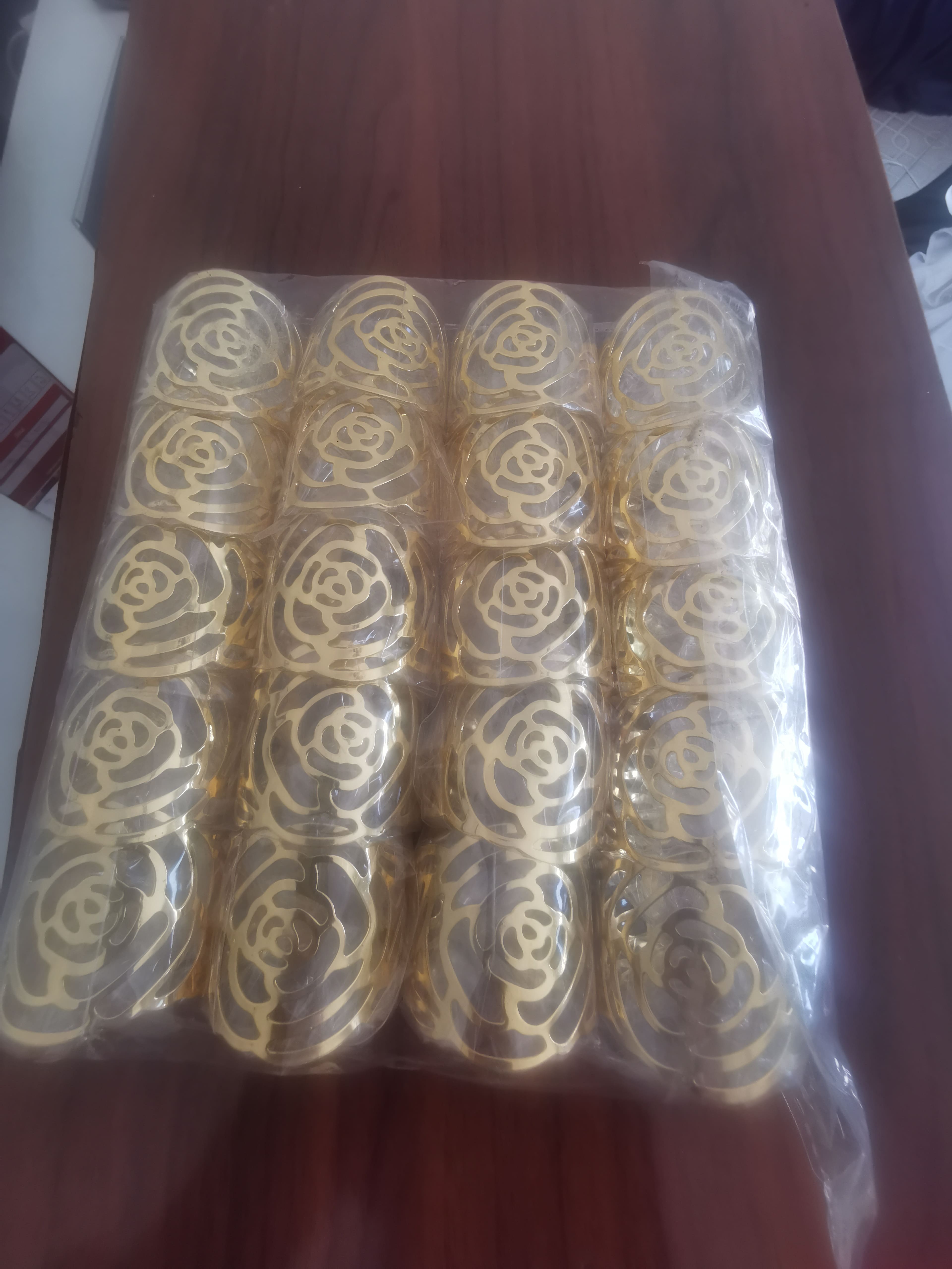 Gold rose napkin rings (