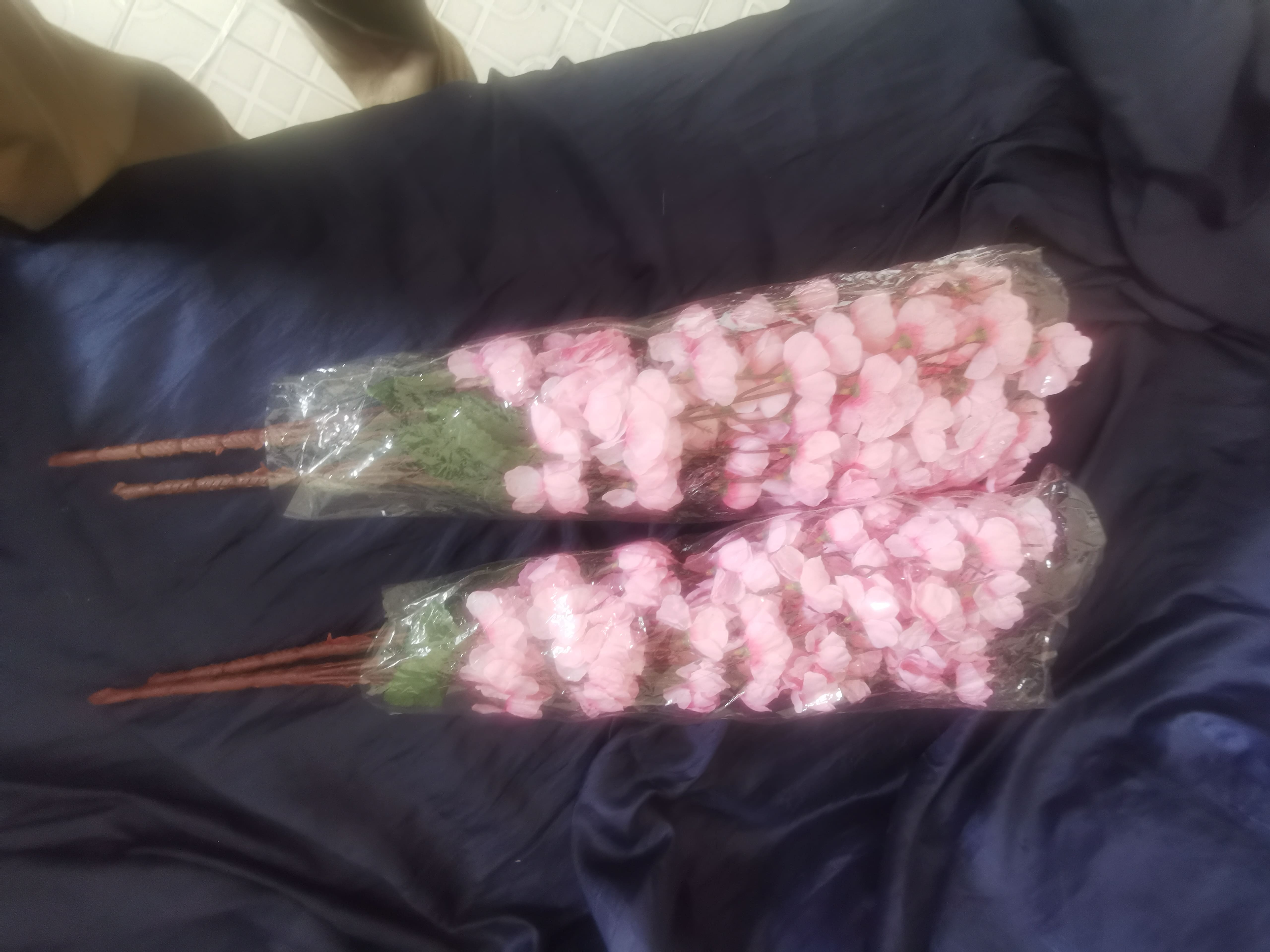 Artificial pink cherry blossom branches