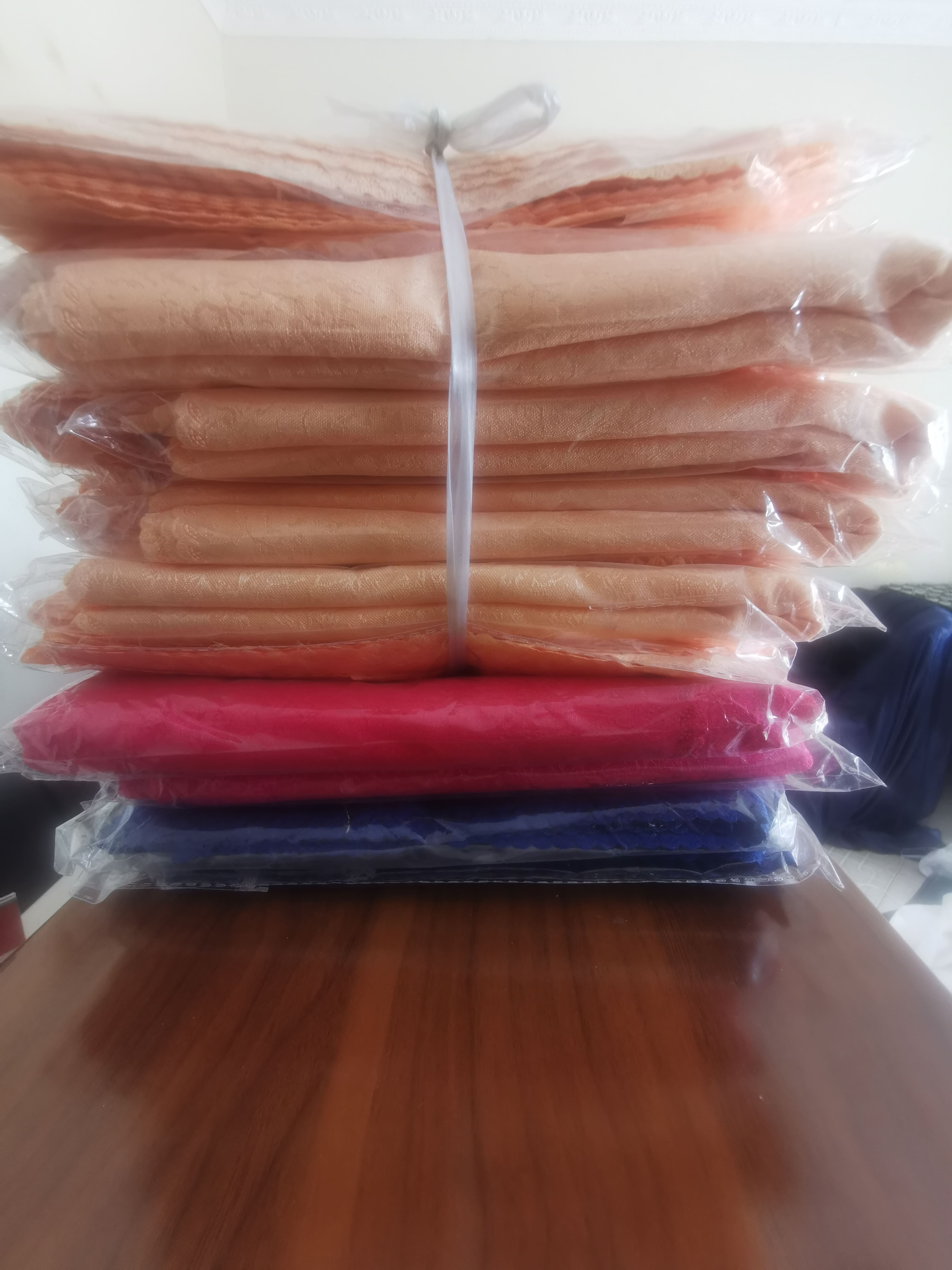 Packaged sheer fabric rolls