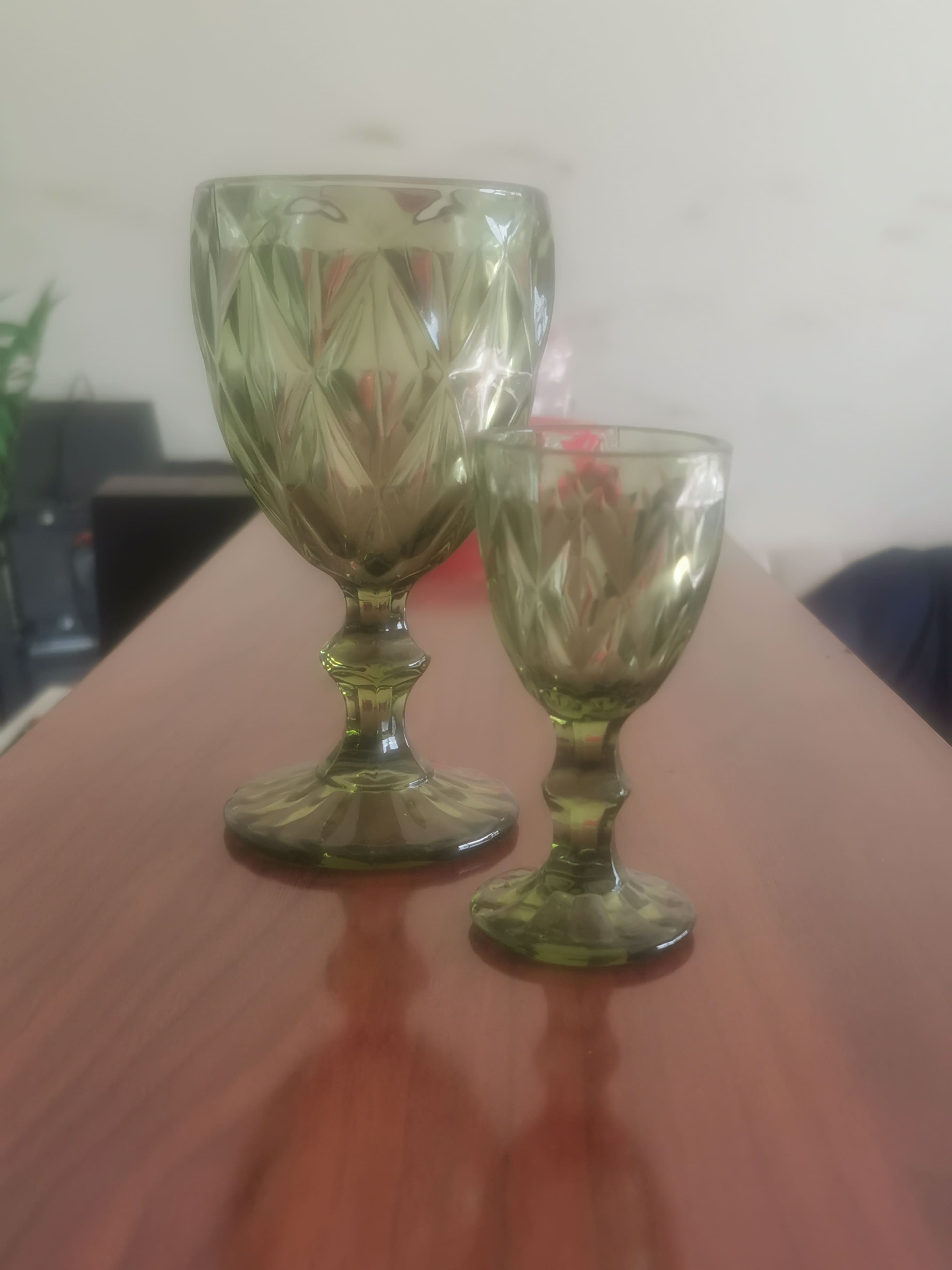 Pair of green goblets/wine glasses with diamond (faceted) cut pattern