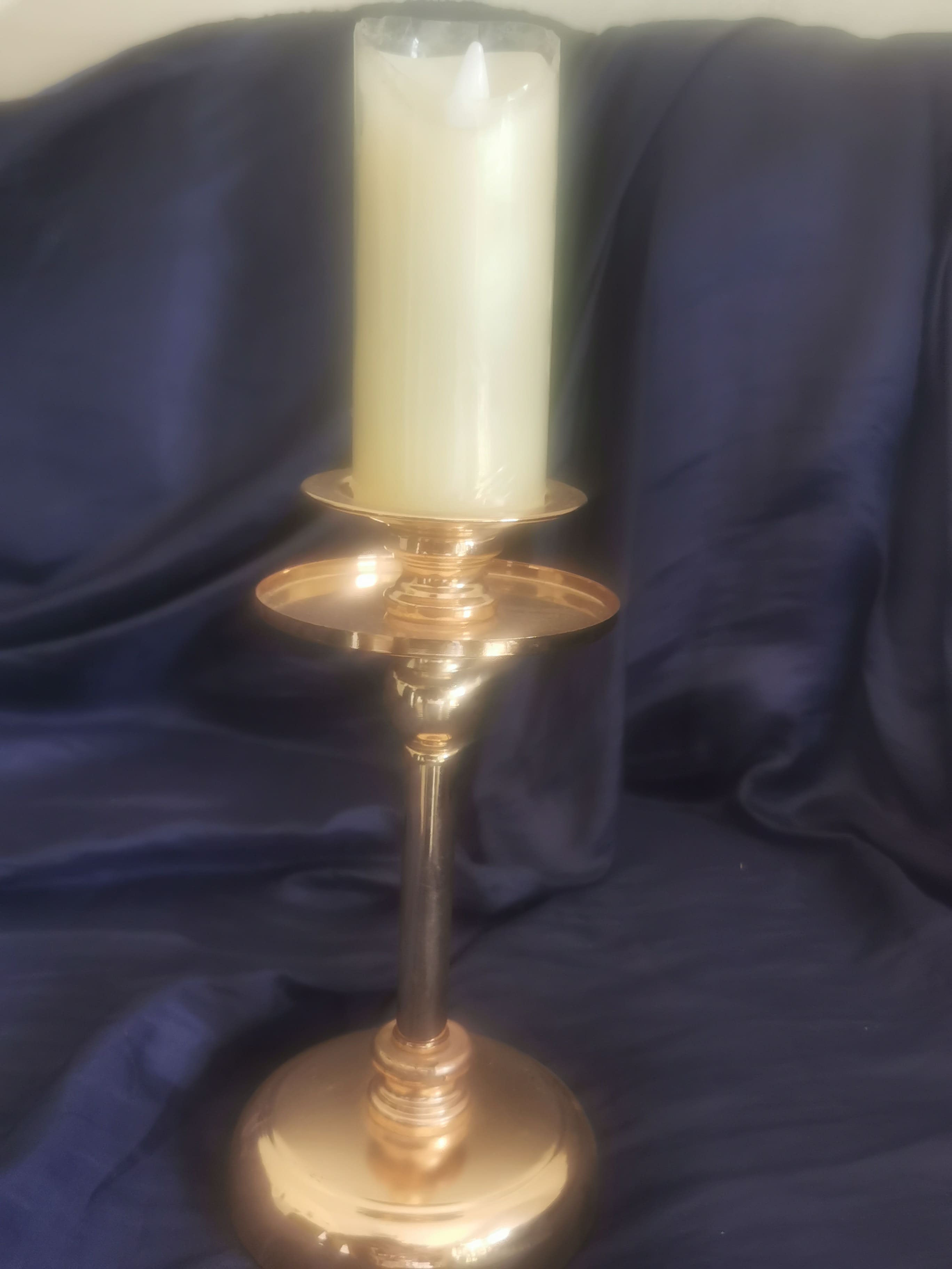 Tall gold/brass candle holder with wide drip tray/base and pillar candle